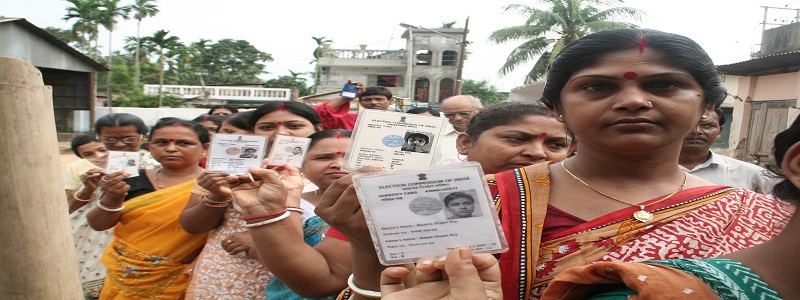 The women voters standing in a queue showing their Election Photo Identity Cards at a polling booth to cast their votes during the 2nd Phase General Elections-2009, in Ramnagar near Agartala on April 23, 2009.